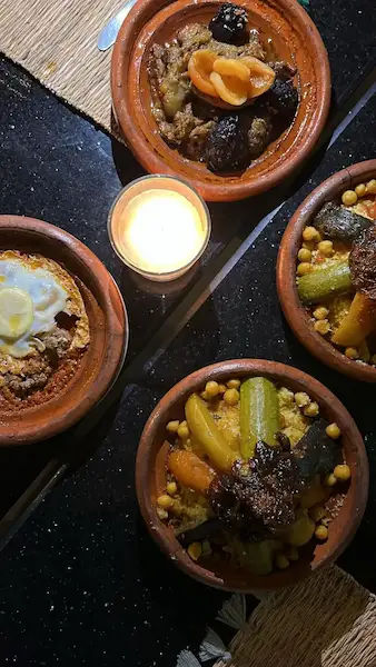 Agafay desert dinner with Moroccan food and lanterns at night